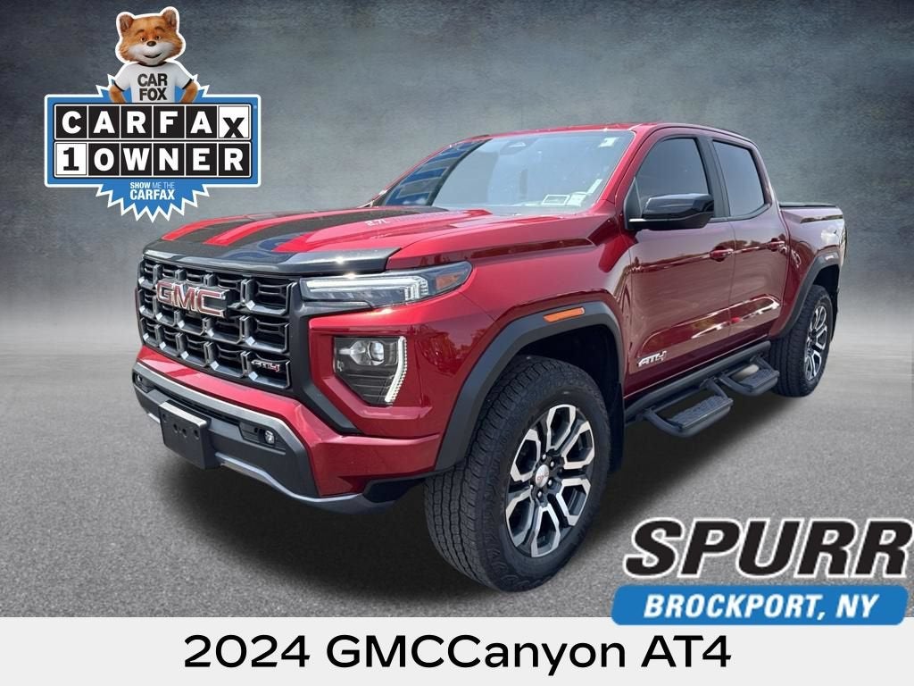 2024 GMC Canyon AT4 in Volcanic Red Tintcoat — front three-quarter view